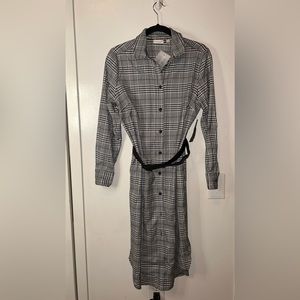 Black and white dress can be worn as a coat also.